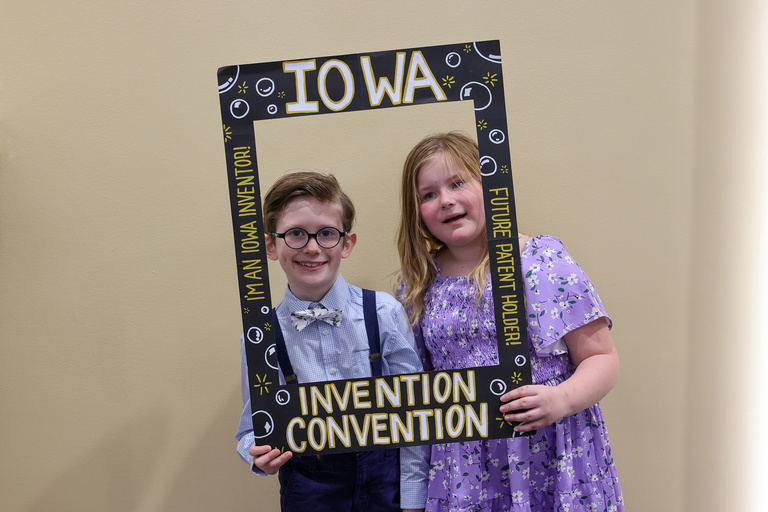 Student inventors taking picture at photo booth