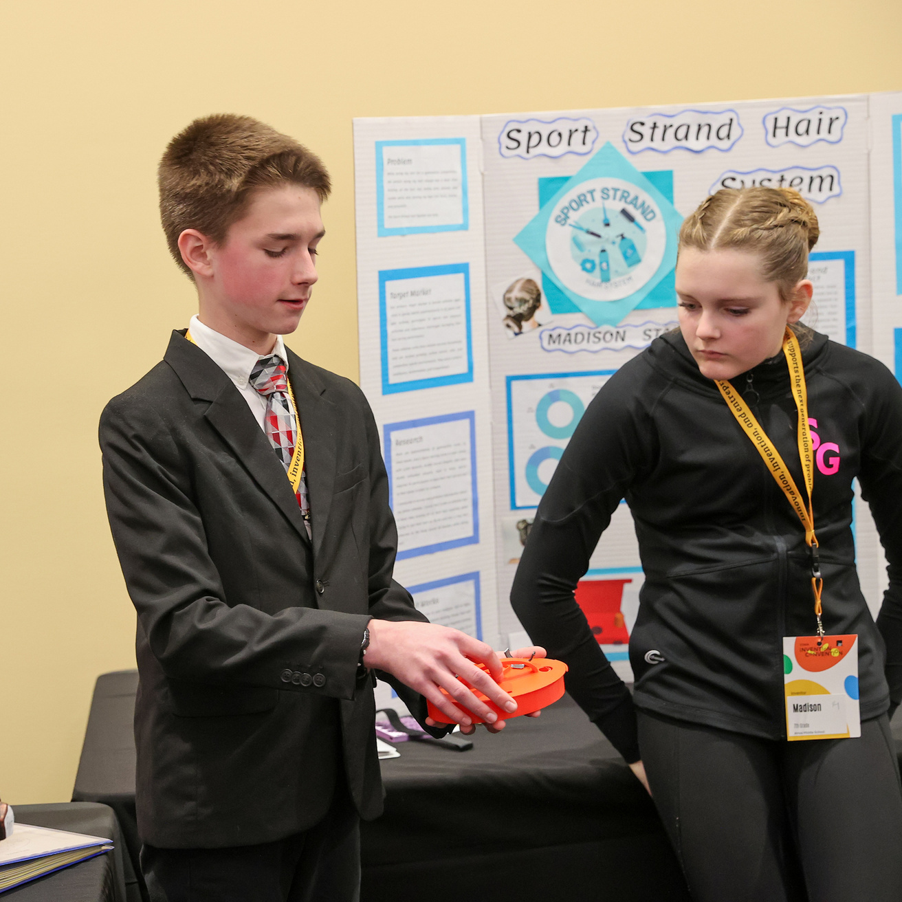 Charles showing his invention to another student