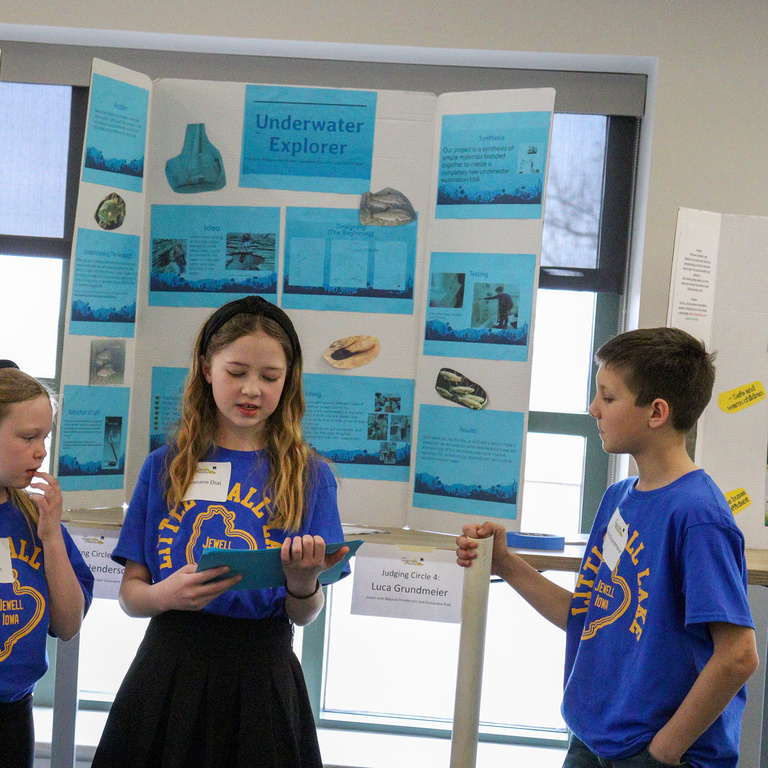 Team of three presenting at the 2025 Iowa Invention Convention 