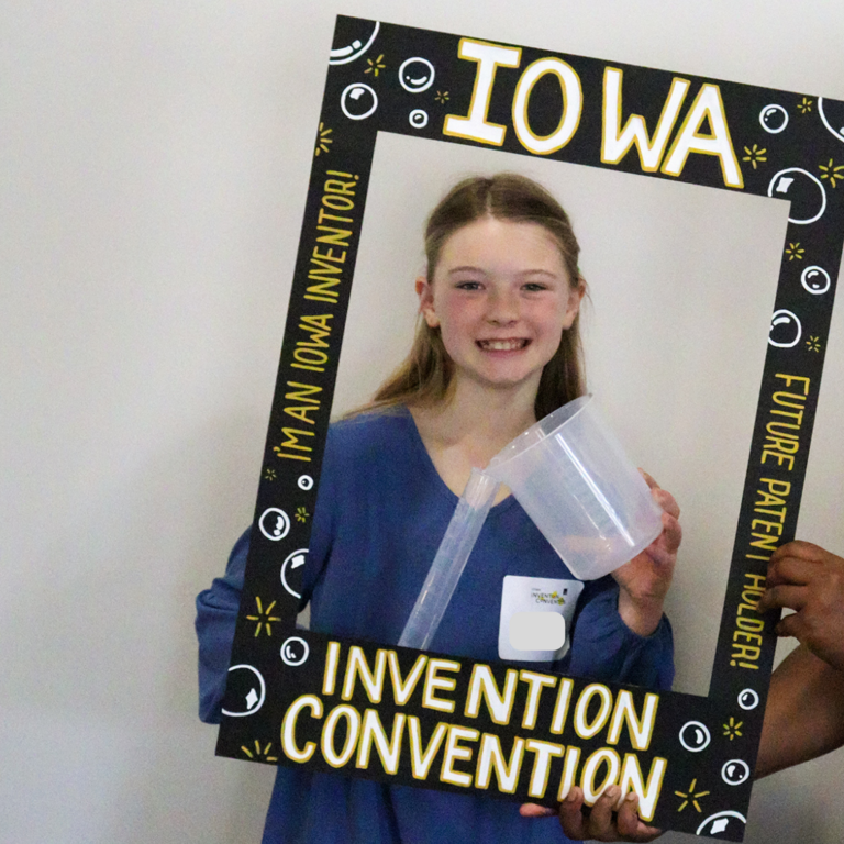 Dasia with a girl inventor at the 2025 Iowa Invention Convention