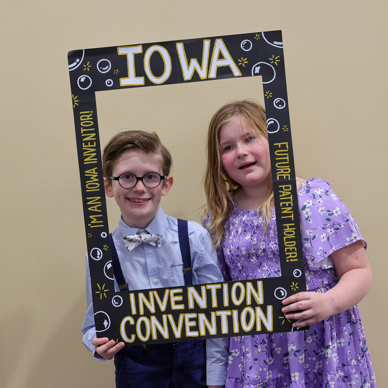Student inventors taking picture at photo booth
