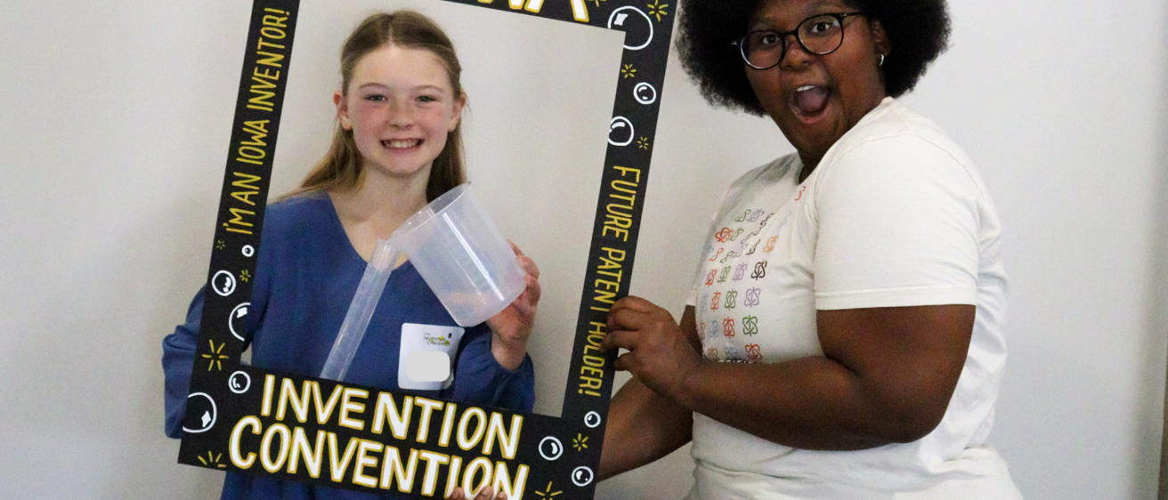 Dasia with a girl inventor at the 2025 Iowa Invention Convention