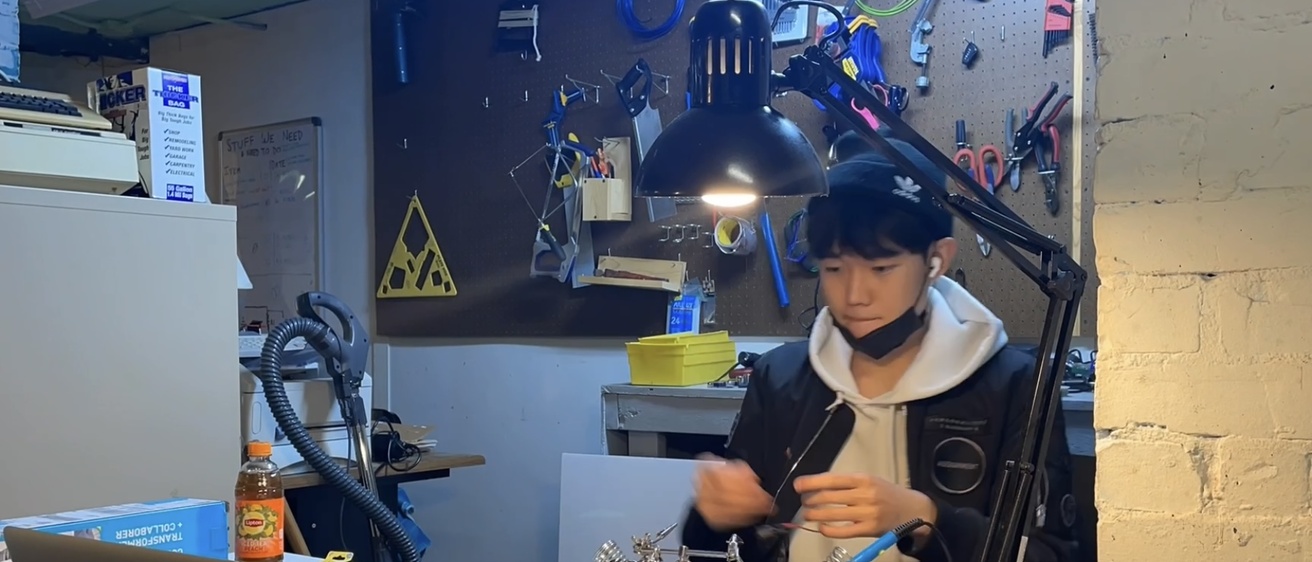Jason building his invention "the ARE board"