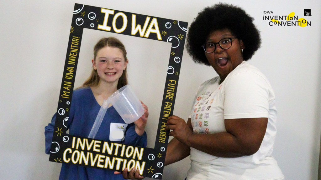 Dasia with a girl inventor at the 2025 Iowa Invention Convention