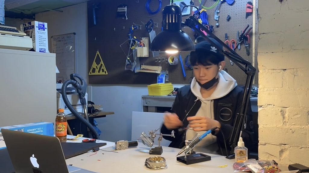 Jason building his invention "the ARE board"